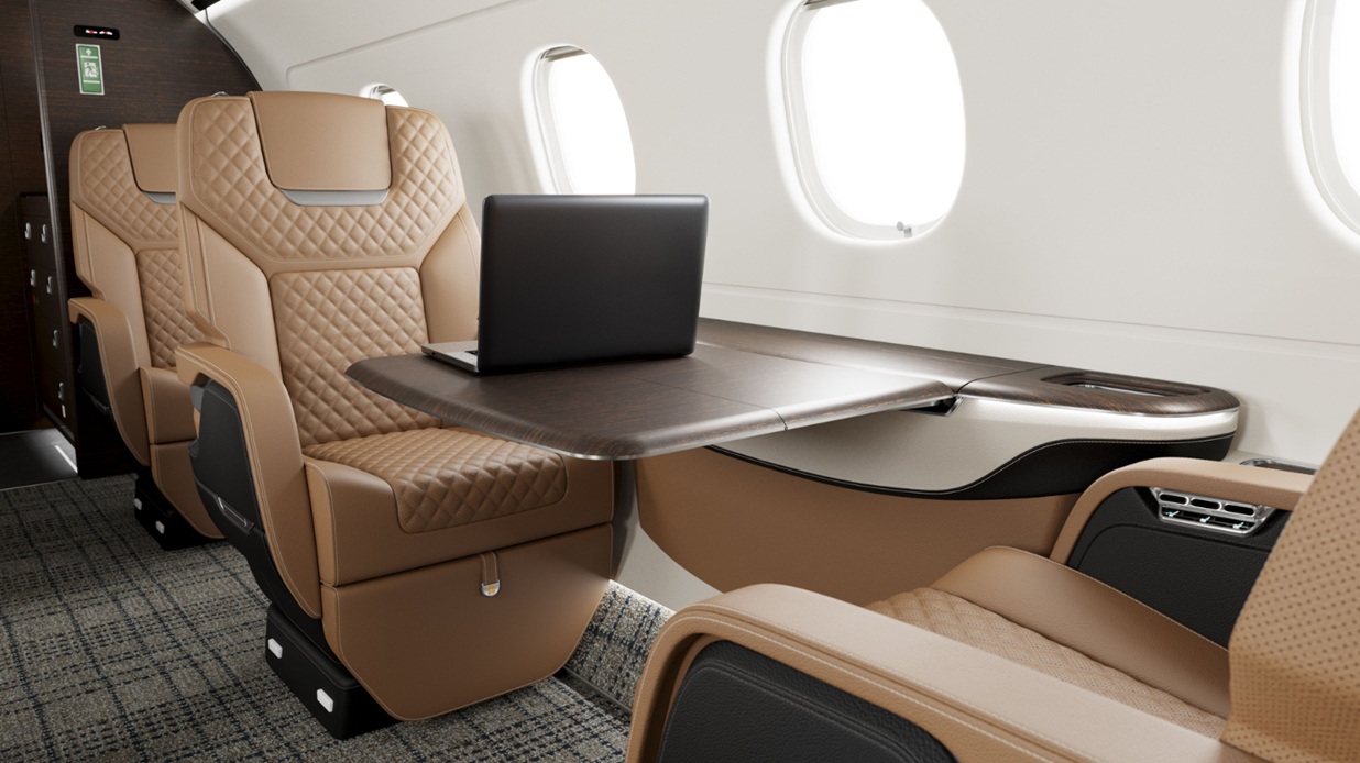 Embraer Praetor 500 cabin seat with a laptop